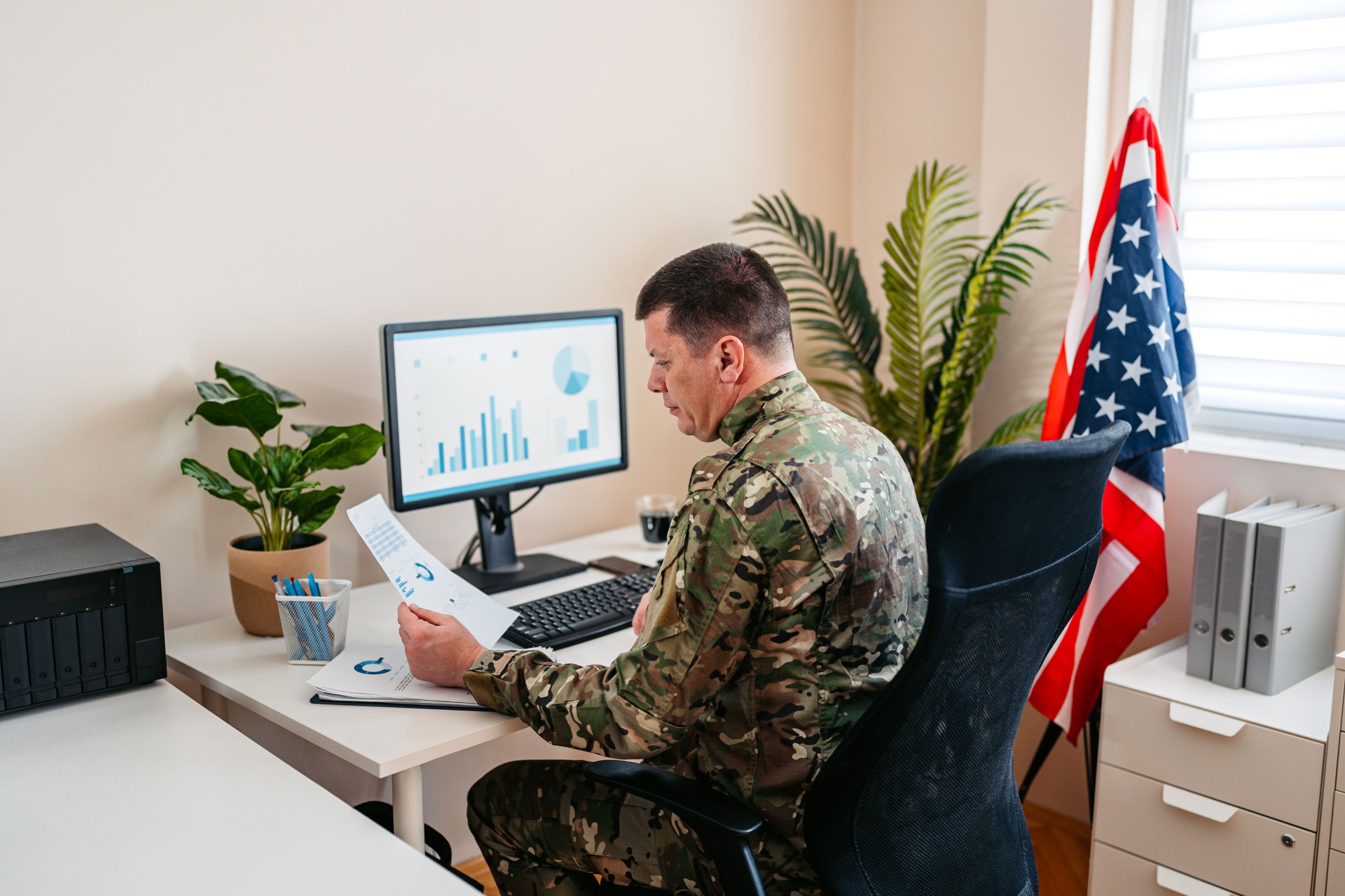 Mid-Adult United States Soldier In A Military Uniform Working On The Computer In The Office
